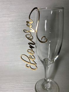 a wine glass with the word boooo on it