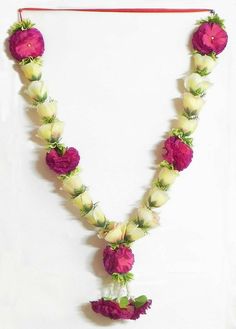 a necklace with flowers and leaves on it