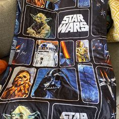 a star wars themed blanket on a couch