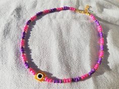 Evil Eye Necklace, Beaded Evil Eye Necklace, Turkish Evil Eye Pendant Pink Evil Eye Necklace Nazar Necklace Cute Purple Evil Eye Bead Choker, Evil Eye Necklace for Summer Necklace lenght is minimum 15 and maximum 16 inches. I ship your jewelry 1-2 bussiness day. Please include your phone number for shipping company. Thank you :) <3 Purple Heart Beads Necklace For Gift, Pink Necklace With Colorful Beads As Fashion Accessory, Pink Necklace With Colorful Beads, Pink Beaded Chain Necklace As Fashion Accessory, Purple Necklaces With Heart-shaped Beads, Purple Necklace With Heart And Round Beads, Trendy Spacer Beads For Gifts, Trendy Purple Round Bead Necklaces, Trendy Purple Necklace With Round Beads