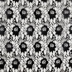 an abstract black and white pattern on fabric