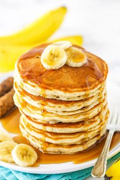 a stack of pancakes with banana slices on top