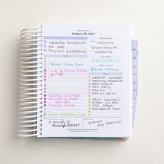 a spiral notebook with some writing on it