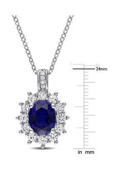 This fashion pendant features oval-cut created blue and white sapphires with accenting smaller diamonds set in sterling silver. Pendant is hung on a cable chain and is secured with a spring ring clasp. | Belk & Co Women's 4 ct. t.w. Created Blue and White Sapphire Diamond Accent Oval Necklace in Sterling Silver Oval Sapphire Necklace With Halo Setting, Oval Blue Diamond Cut Necklace, Blue Oval Diamond Cut Necklace, Sapphire Necklace With Oval Halo Setting, Oval Sapphire Necklace With Hallmark, Oval Sapphire Necklace With Brilliant Cut, Sapphire Pendant With Diamond Accents, Oval Sapphire Jewelry, Hallmarked, Oval Sapphire Hallmarked Jewelry