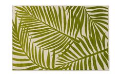 a green and white rug with palm leaves on it