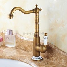 a bathroom sink with a faucet and soap dispenser