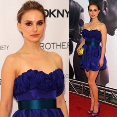 a woman in a blue dress and purple shoes at the premiere of her new movie