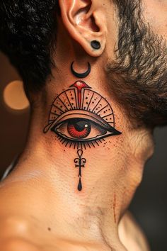 a man's neck with an eye tattoo on it