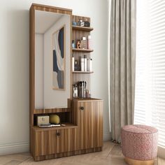 a wooden cabinet with shelves and drawers in front of a large mirror on the wall