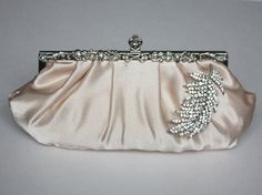 Great classic elegant clutch Chic Wedding Clutch With Rhinestones, Champagne Evening Bag For Wedding, Elegant Satin Clutch For Wedding, Chic Satin Evening Bag For Wedding, Elegant Rectangular Clutch For Mother Of The Bride, Bridal Bags, Bella Bridal, Elegant Clutch, Feather Brooch