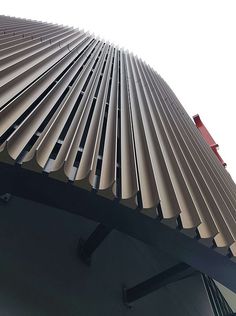 the top of a building with many vertical lines on it