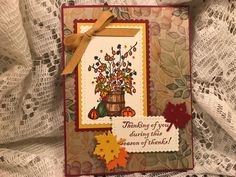 a greeting card with an autumn scene and saying thank you, during this season of thanks