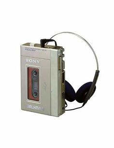 an old fashioned cassette player with headphones attached to it's earpieces