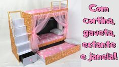 a doll house made out of cardboard with pink and white polka dots on the bed