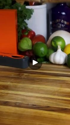 a wooden table topped with lots of vegetables