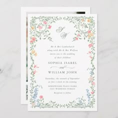 an elegant floral wedding card with the letter d on it's front and bottom