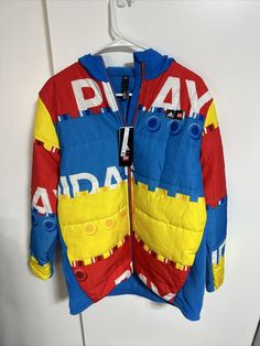 Adidas x Lego U Lego W Puffer Padded Jacket Retail Sz XL Youth NWT Multicolor Hooded Puffer Jacket, Multicolor Long Sleeve Puffer Outerwear, Multicolor Hooded Puffer Outerwear, Hooded Multicolor Puffer Outerwear, Casual Multicolor Puffer Jacket, Adidas Winter Outerwear For Cold Weather, Casual Multicolor Winter Puffer Jacket, Casual Patchwork Puffer Jacket, Adidas Multicolor Long Sleeve Outerwear