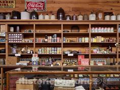 a store filled with lots of different types of food and drinks on shelves next to each other