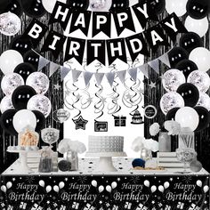 a birthday party with black and white balloons