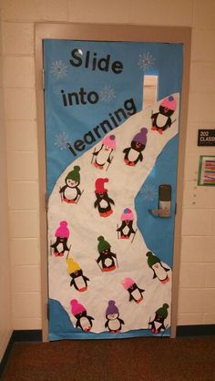 a door decorated with penguins and the words slide into learning