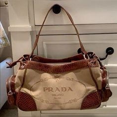 Prada Strap Bag, Designer Shoes And Bags, Bags With Keychain, Aesthetic Designer Bags, Vintage Designer Purses, Pretty Things To Buy, Unique Designer Bags, Vintage Designer Bags Aesthetic, Cute Handbags Designer