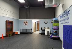 the inside of an office building with various items on the floor