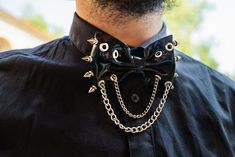 Be nonchalant on every party or creative black tie event with our unisex latex bowtie. It is fastened in the back on two snap buttons and decorated with eyelets, spikes and two chains. Bowtie is made of top quality latex. Available in various colours.  Size Chart:  Neck Circumference  XS 13''- 13.7'' 33-35 cm  S 14''-15'' 36 - 38 cm M 15,3'' - 16,5'' 39-42 cm L 17,3'' - 18,5'' 44-47 cm XL 18,8'' - 20'' 48-51 cm Edgy Halloween Costume Accessories For Party, Alternative Black Costume Accessories For Party, Creative Black Tie, 27 Club, Eve Outfit, Adam And Eve, Black Tie Event, Tie Accessories, Nice Shorts