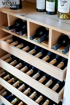 several bottles of wine are sitting on the shelf