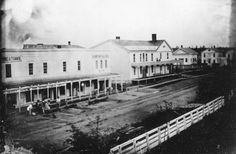 an old black and white photo of a town