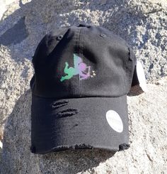 Cupid Angel - Dad Hat/Baseball Cap - Reflective Holographic Vinyl - Vintage - Distressed -Unisex - Adjustable - Black - 100% Cotton  - $25.00 PLEASE READ BEFORE BUYING !! This is a rainbow holographic vinyl hat. You may only see the reflection of rainbow colors when the direct flashlight is pointed towards the design on the hat. Refer to all pictures and videos included. Pictures are taken with camera flash ON and OFF to demonstrate the rainbow holographic vinyl. Product Color: Hat Color : Black Design : Rainbow Holographic Vinyl Features: Rainbow Holographic Vinyl. ✔️ Vintage Distressed Washed Style.✔️100% Cotton Made.✔️Lightweight / Durable / Smooth.✔️Adjustable Metal Buckle Back Closure, Great Fit for Most Head Sizes.✔️Dad Hat, Low Profile Unconstructed.✔️Made in Los Angeles. Black Casual Unisex Hat, Black Casual Hat, Vinyl Hat, Vinyl Vintage, Rainbow Hats, Colorful Hat, Distressed Hat, Holographic Vinyl, Hat Baseball