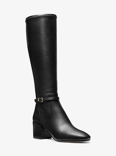 With a clean, classic silhouette and a slim buckled strap at the ankle, the Ella is the wear-with-everything boot you’ve been looking for. The dark, stacked heel extends the long line of the boot and keeps you walking tall day and night. Medium Width High Shaft Boots For Work, Ankle Strap Heeled Boots For Workwear In Fall, Ankle Strap Boots With Buckle Closure For Work, Classic Tall Boots For Office, Buckle Closure Ankle Boots For Work, Fall Ankle Strap Workwear Boots, Formal Fall Boots With Ankle Strap, Fall Workwear Ankle Strap Boots, Formal Fall Ankle Strap Boots