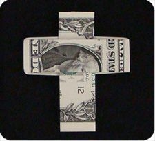 a cross made out of one dollar bill