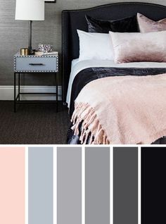 a bedroom with gray walls, black and white bedding, pink throw pillows, grey wallpaper