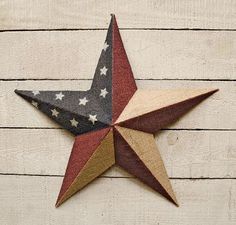 a wooden star with red, white and blue stars on it