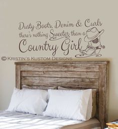 a bedroom wall decal with the words country girl on it and a bed in front