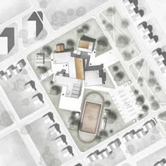 an aerial view of a building and its surrounding courtyards, including a basketball court