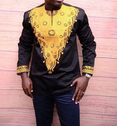 Elegant African Men Shirt inspired by The Black Panther.  A Breath-taking Intricately Embroidered Men Shirt. This apparel has unique detail lines beautifully crafted for occasions and function alike. Wakanda forever Our Measurment  XS - Chest 42  Armpit to Armpit 21 L- Chest 44/46 Armpit to Armpit 23 XL- Chest 48     Armpit to Armpit 24 XXL- Chest 50  Armpit to Armpit 25 XXXL -Chest 52 Armpit to Armpit 26 You can Give us your own measure Black Long Sleeve Tops For Festivals, Gold Long Sleeve Top For Festivals, Fitted Long Sleeve Tops With Traditional Patterns, Festive Long Sleeve Tops With Traditional Patterns, Traditional Long Sleeve Gold Top, Dashiki Dress, The Black Panther, Fashion Drawing Sketches, Wakanda Forever