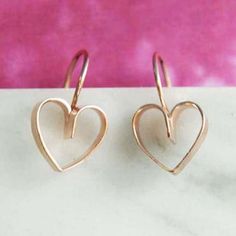 Dainty, cute and highly wearable, these Lace Heart Drop Earrings are made by our silversmith by shaping flat Sterling Silver wire carefully and creatively into a heart profile and attaching the ear wire before being plated in Rose gold in our UK workshop. Available in Silver, Gold and Rose Gold vermeil, the earrings can be paired with the matching pendant necklace creating a lovely jewellery set ideal for gifting. Also available in: 18k Yellow Gold Plated Sterling Silver Made from: Vermeil - 18kt rose gold plated sterling silver. Meaurements: Earrings dimensions: approx 1 cm width and 1 cm height. Pendant size: approx. 1.2 cm width and 1.4 cm heigt. Our standard chain length is 16'' plus 2'' extensions which makes the total length 18'' Rose Gold Drop Earrings, Gold Heart Earring, Lace Heart, Rose Gold Heart, Heart Drop Earrings, Lovely Jewellery, Matching Necklaces, Heart Of Gold, Pendant Set