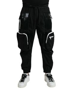 Dolce & Gabbana nylon jogger sweatpants. Style: Casual sweatpants Color: Black Fitting: Regular fit Material: 100% Nylon Stretch waist band with pull string closure Logo details Made in Italy Black Sweatpants With Elastic Cuffs For Streetwear, Sporty Joggers With Multiple Pockets For Streetwear, Black Nylon Cargo Pocket Joggers, Black Urban Nylon Joggers, Sporty Black Nylon Cargo Pants, Black Nylon Urban Joggers, Black Nylon Sporty Cargo Pants, Black Jogging Pants With Elastic Cuffs, Black Sporty Parachute Pants With Multiple Pockets