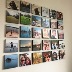 a wall with many pictures hanging on it