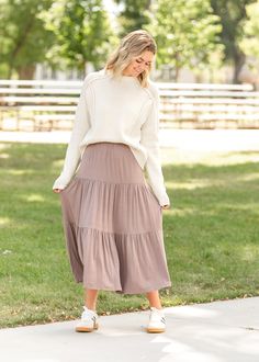 The Nellie Tiered Maxi Skirt is a modest and elevated skirt you will love for church or everyday! This modest maxi skirt was designed to make movement comfortable and effortless all while looking put together and feeling beautiful. It has tiers with an elastic waist for a flattering and modest fit, and it is made in the USA! Just add your favorite bodysuit, denim jacket, and mules for an effortless look! Style | Maxi Color | Mocha SIZING TIPS Fit | Semi-Fitted Stretch | Stretchy Model | True to Maxi Skirts Fall, Looking Put Together, Maxi Skirt Fall, Skirts Outfits, Modest Maxi, Winter Skirt Outfit, Modest Fits, Tiered Maxi Skirt, Winter Skirt