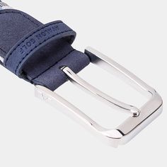 a blue belt with silver buckles on it