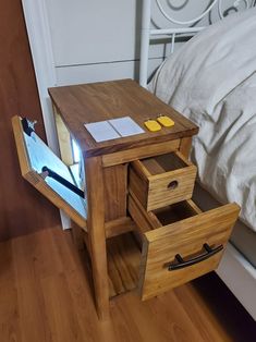 a small wooden table with two drawers on it