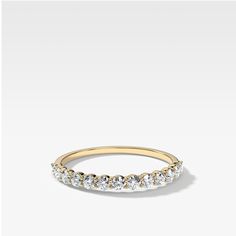 Tiny round cut diamonds in a shared prong setting lend their delicate sparkle to this petite and exquisite band. 2.0 mm band 0.50 carats total available in rose, yellow and white gold (select size and metal at checkout) Questions? Want to modify this ring? CONTACT US Nervous About Buying Jewelry Online? READ THIS Made in the USA. All sales are final. All Good Stone pieces are made to order – please allow 3-4 weeks for production, followed by 1-2 days for shipping! Trust us - we’re worth the wait