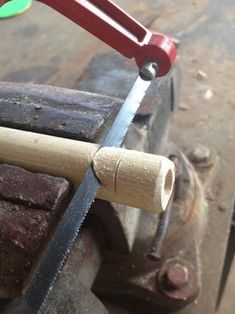 a piece of wood being cut with a saw