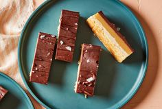 three pieces of chocolate cake on a blue plate