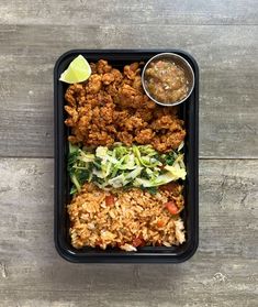 a black container filled with different types of food