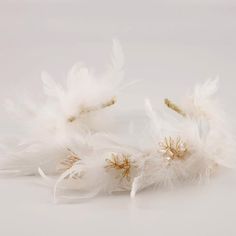 This gorgeous Zuriel luxury headband lives up to it;s name! Divine beauty personified handmade from soft white feathers forming a tiara style hair accessory, The designer headband is embellished with gold hand wired strands of pearls. A perfect accessory for all occasions, perfect for flower girls. Each piece comes in a branded Sienna Likes To Party gift pouch White Hair Accessories, White Hair Accessory, Luxury Headbands, Designer Headbands, Hair Slides, Divine Beauty, Head Bands, Hair Slide, Gold Hand