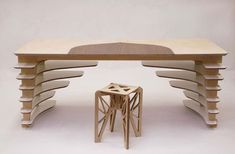 a table and stool made out of plywood