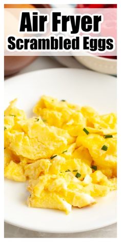 scrambled eggs on a white plate with text overlay that reads air fryer scrambled eggs